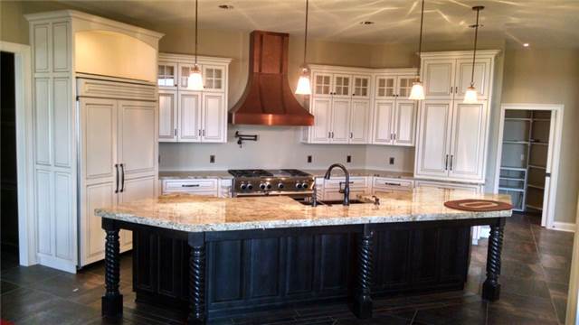 Painted and glazed perimeter cabinets - Maple island with Tobacco stain - Granite countertops